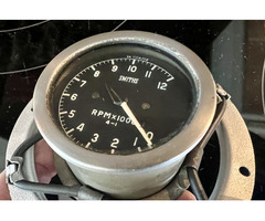 Original SMITHS rev counter complete with holder. - 2